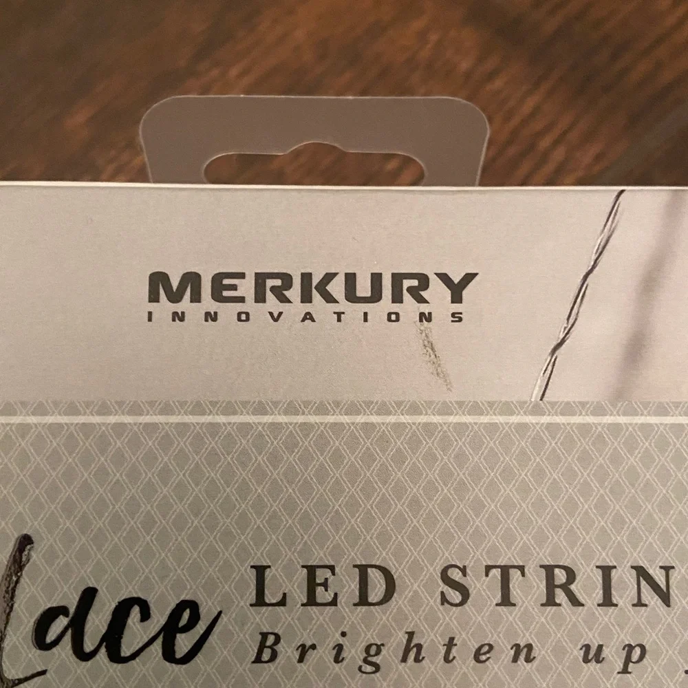 Mercury Innovations Cotton Clear Globe LED String Lights wrapped in white lace.